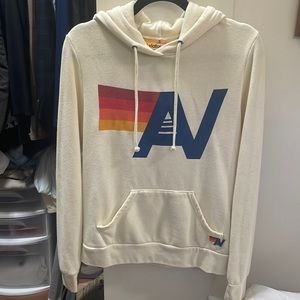 Vintage white pullover logo hoodie from Aviator Nation.